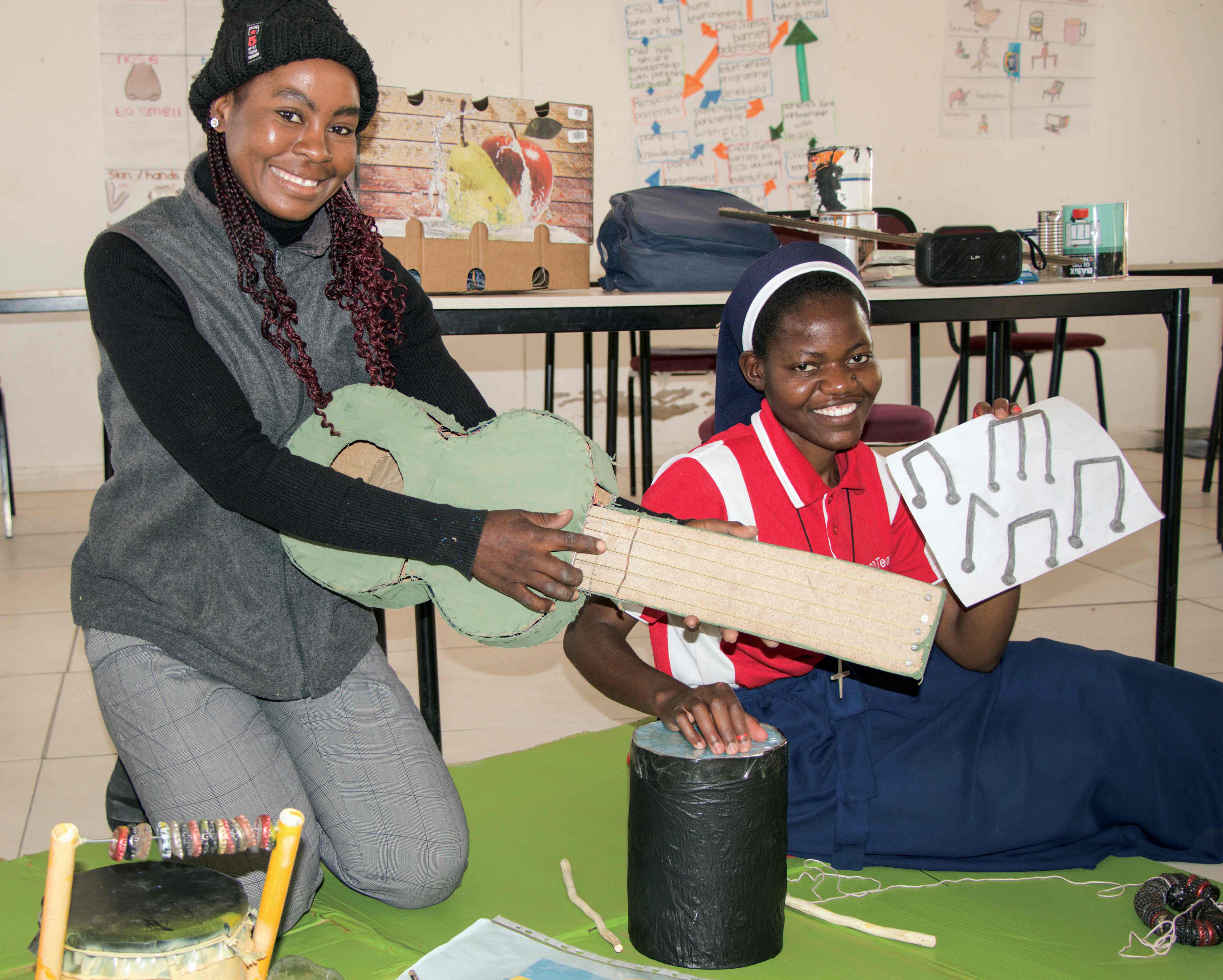 ECD Student in a group to produce music materials