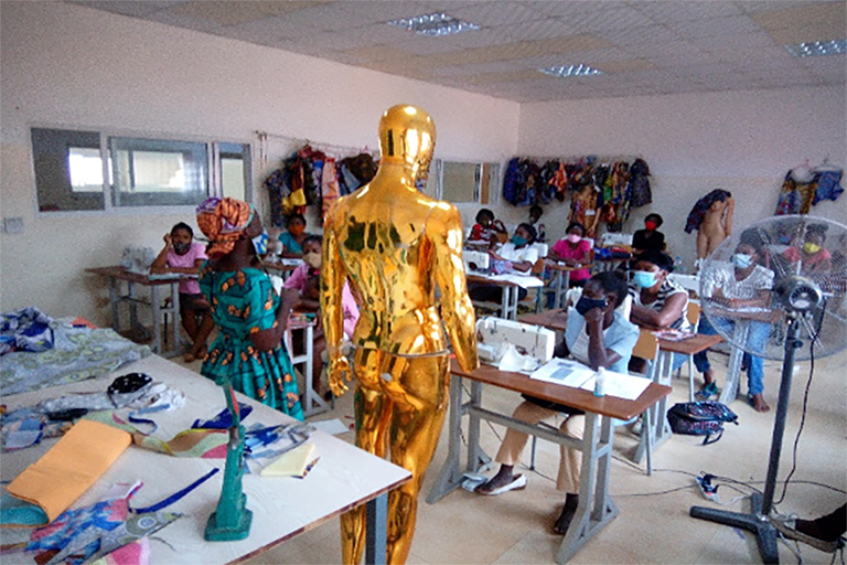 Group 3 women holding a training on title Cutting and Sewing mens attires