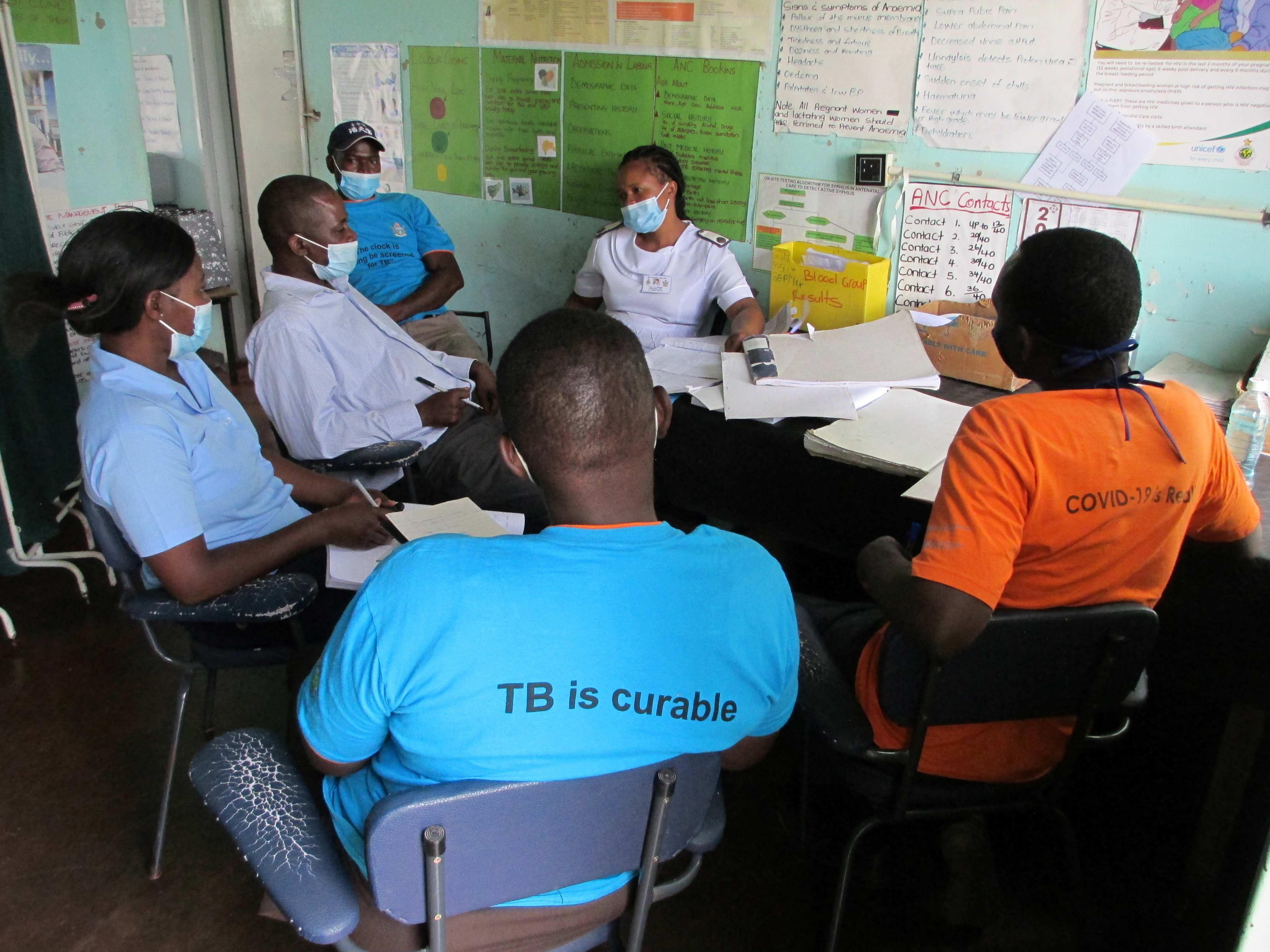 Outreach offiers meeting with local clinic nurse in charge